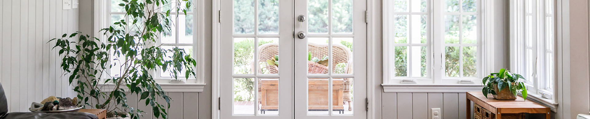 White Windows and Doors on Gray Beadboard Walls in Sunroom