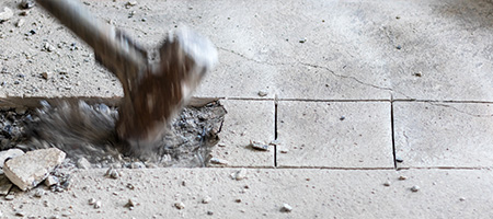 Sledgehammer Breaking Concrete