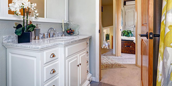 White Vanity Adds Storage to Small Bathroom