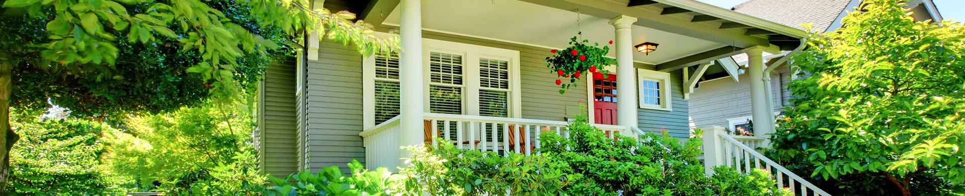 Small Grey House With White Porch