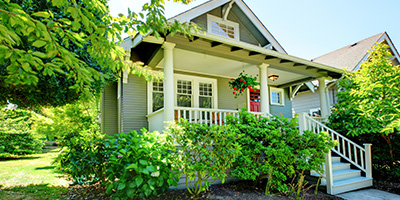 Small Grey House With White Porch