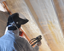 Worker Installing Spray Foam Insulation