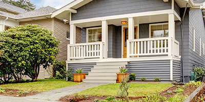 Grey House With Porch and Small Yard