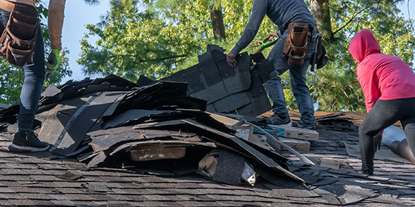 Three Workers Removing Roofing