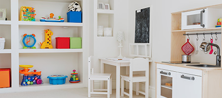 Children's toy kitchen set up in basement