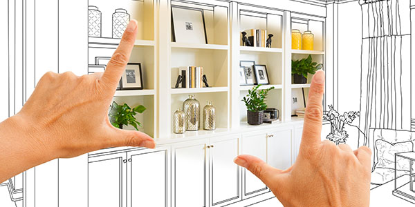 Hands Framing Built in Shelves in Living Room