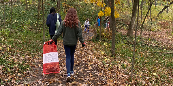 Volunteers Picking Up Trash Along Trail