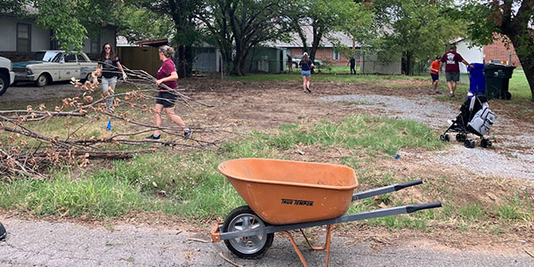 Volunteers Cleaning Up Yard