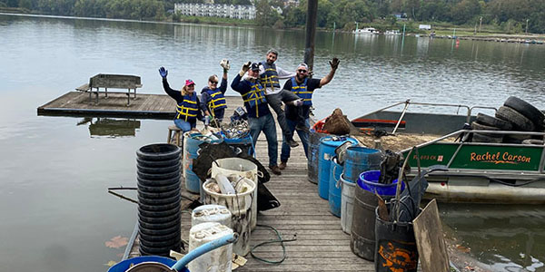 Volunteers Pose On a Boating Dock