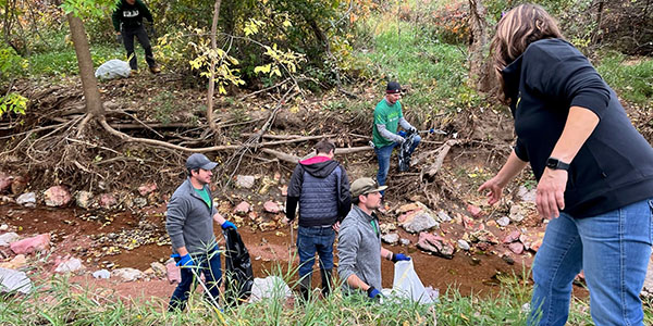 Volunteers Pulling Litter From Fountain Creek