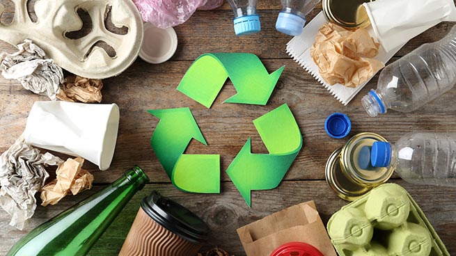 Green Recycling Icon Surrounded by Trash