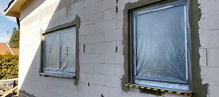 House With Plastic Over Windows