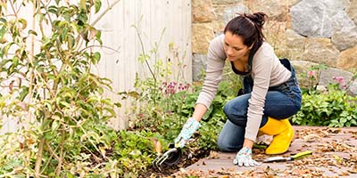 Woman Preparing Garden for Winter