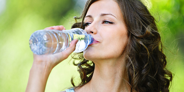 Woman Drinking From Water Bottle