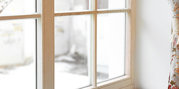 Large Wooden Window with Floral Curtains