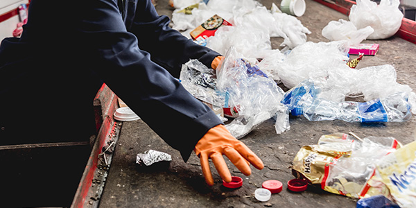 Person Picking Up Trash