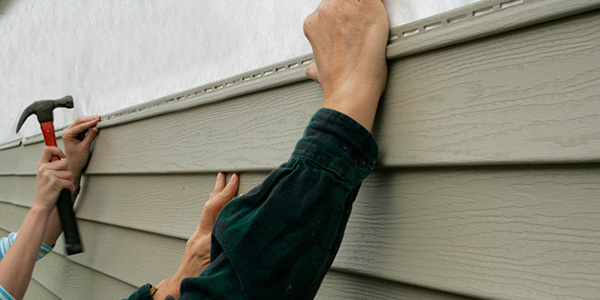 Workers Installing Vinyl Siding