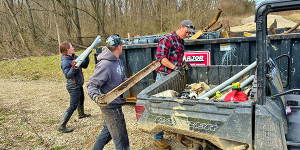 WRLC Staff Filling Dumpster