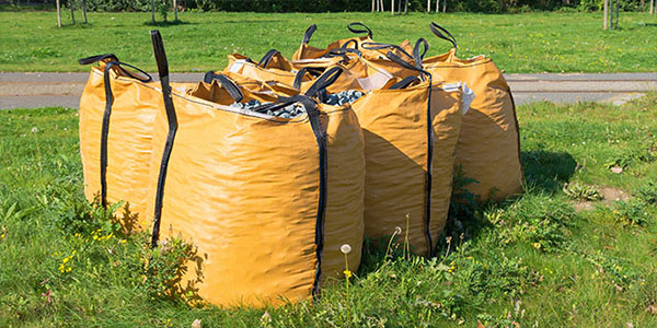 Yellow Dumpster Bags on Grass