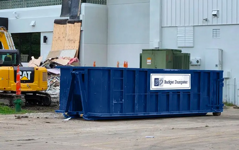Blue Roll Off Dumpster On a Construction Site