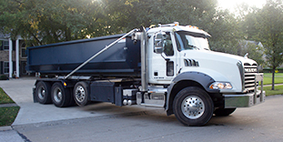 Roll Off Truck Backing into Driveway