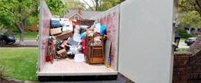 Roll Off Dumpster Halfway Loaded With Junk