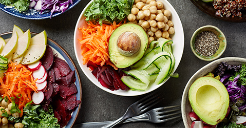 Bowls of Salads and Greens Sitting On a Table