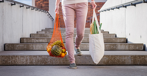 Woman Carrying Groceries in Reusable Bags