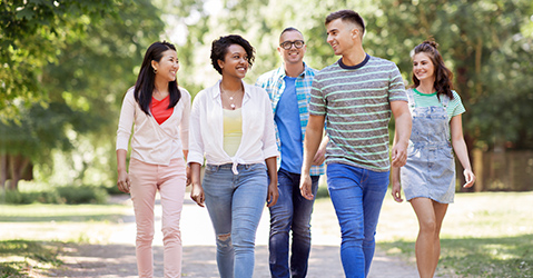 Group of Five People Walking On a Path