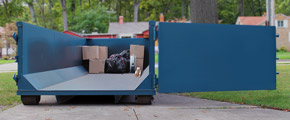 Partially Filled Dumpster With Open Door