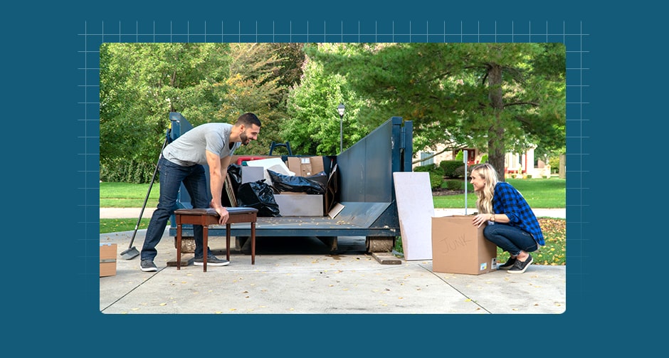 Husband and wife loading dumpster
