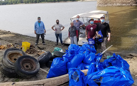 Volunteers Standing in Front of the Missouri River