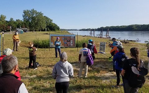 Volunteers waiting to help with a river cleanup. 